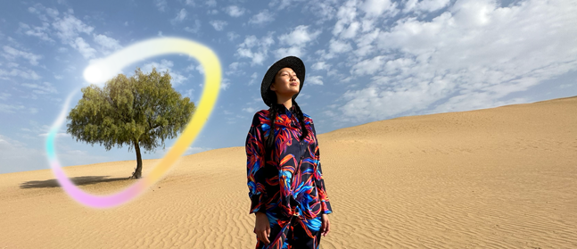 iPad Pro, front exterior display with dark blue and green gradient background with multiple apps open, hand holding Apple Pencil Pro circling a sketch showing Apple Intelligence Image Wand feature